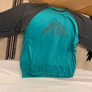 Turquoise and gray colored marmot rafting sun shield shirt